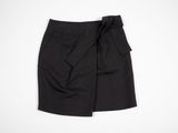 a black skirt with a bow at the waist