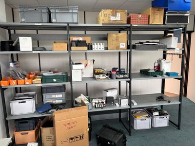 a room with a bunch of boxes and boxes on the shelves