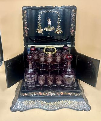 a black box with a set of perfume bottles in it