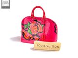 louis vuitton handbag in pink with floral design and cork stopper