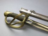 a close up of a pair of swords on a table