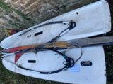 two paddle boards laying on the ground next to each other