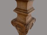 a wooden table with a vase on top of it