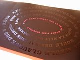 a close up of a book with a spiral design on it