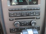 a car dashboard with a clock and radio in it
