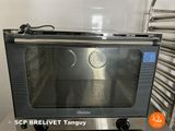 a toaster oven sitting on a counter in a kitchen