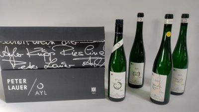 three bottles of wine sitting next to each other on a table