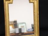 a small mirror that is sitting on a table