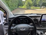 the interior of a car with a steering wheel, dashboard, and dash board