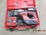 a red tool box with tools in it on the floor