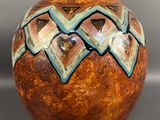 an image of a vase with a decorative design on it