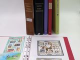 a lot of books that are sitting on a table