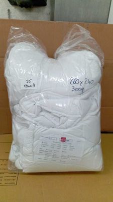 a bag of white yarn sitting on top of a cardboard box