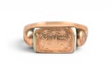 an image of a gold ring with a roman numeral on it