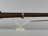 an old rifle with a wooden barrel and a wooden case
