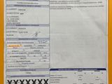 a close up of a receipt on a yellow surface