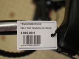 a label on the handle of a bicycle that says velo tnt tension