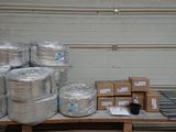 many rolls of aluminum foil sitting on a table