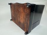an old wooden magazine holder with wheels on a white background