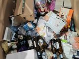 a cardboard box full of beer bottles and other items