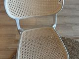 a chair that is sitting on a rug on the floor