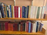 many books that are on the shelves in the room