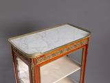 a marble top display case with shelves on it