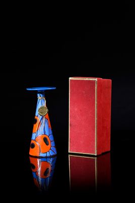 a red box and a blue vase sitting next to each other