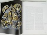 an open book with a picture of a man riding on a horse