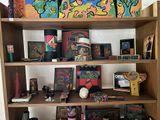 a wooden shelf with many different items on it