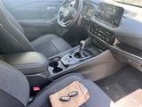 the interior of a car with a steering control and dashboard controls