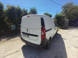 the back of a white van parked in a parking lot