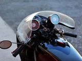 a close up of a motorcycle ' s headlight on the street