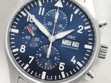 a close up of a wrist watch with a blue dial