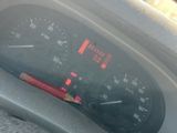 a close up of a car dashboard with a speedometer