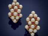 a pair of pearl and ruby earrings