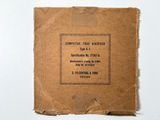 a brown box with a label on it on a white surface