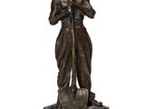 une statue représentant un homme tenant une pelle à la main