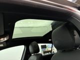 a view of the inside of a car from the driver ' s seat