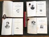 several open books on a table with scissors and a pair of scissors