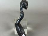 an image of a sculpture of a person holding a knife