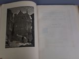 an open book with a picture of a building on it