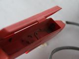 a small red device that is sitting on a table