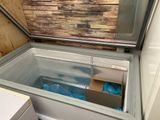 a box that is inside of a refrigerator in a room