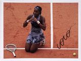 signed photograph of a woman sitting on a tennis court holding a tennis racquet