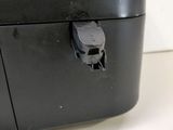 a close up of a black and white machine on a table
