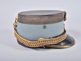 a hat with a chain around it on a white surface