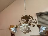 a chandelier hanging from the ceiling in a room