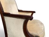 an upholstered chair with a footstok and foot rest
