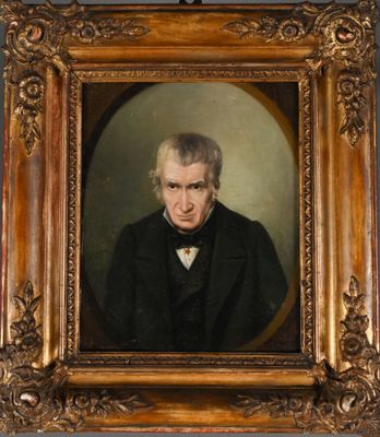 portrait of a man in a black coat and bow tie
